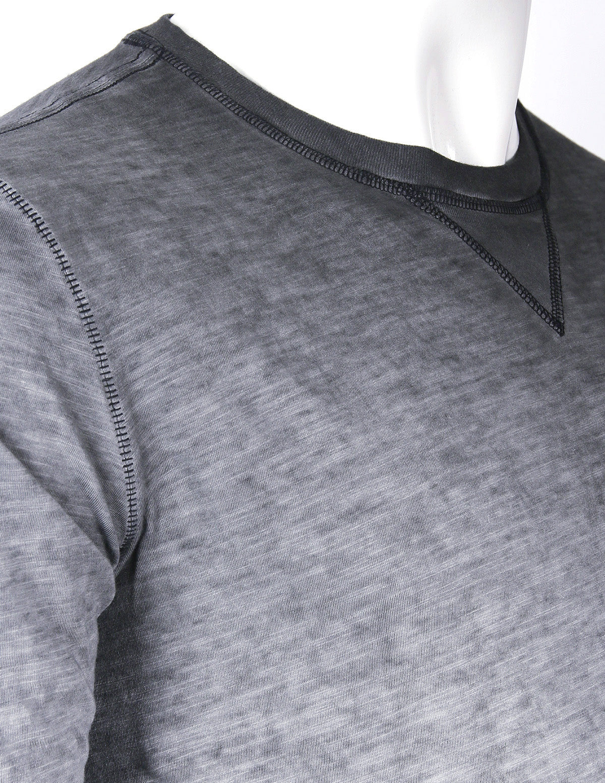 ZIMEGO Mens Long Sleeve Crewneck Oil Wash Vintage Raw Edge Hem Hipster Hip-Hop T shirt close-up on dark fabric.