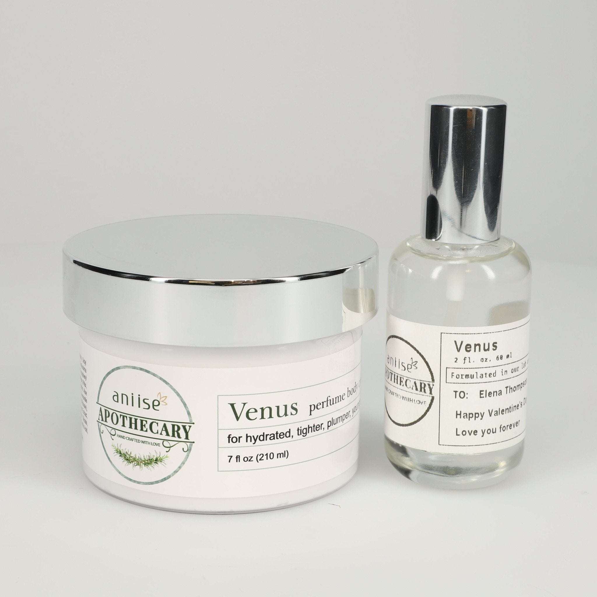 Luxury fragrance oil set including Venus perfume body cream and fragrance oil bottle.