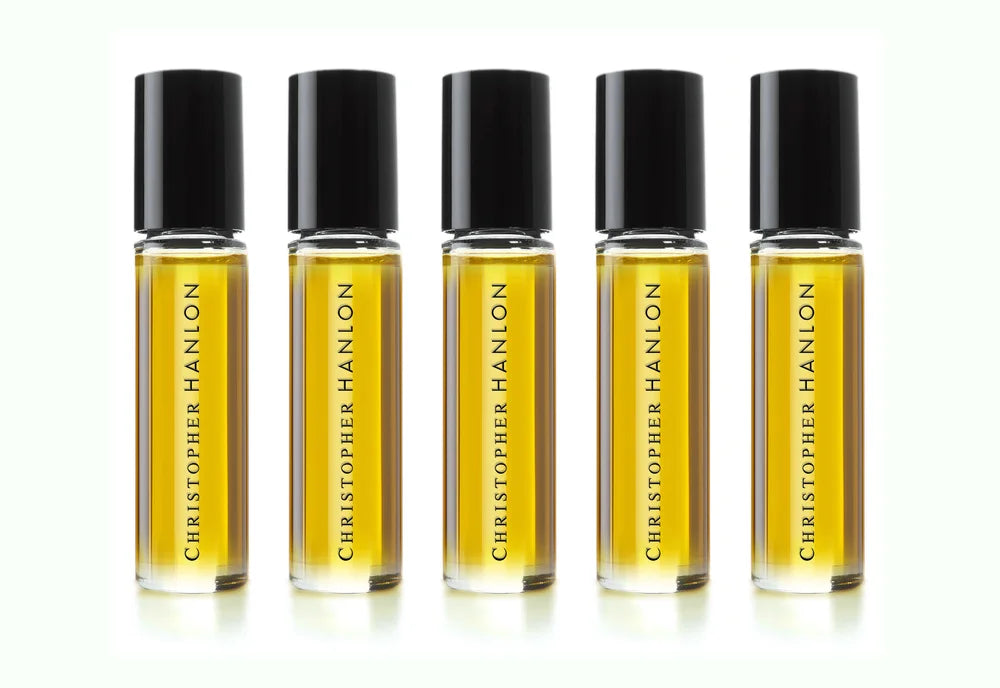 Five 10ml glass vials of artisan perfumes from the free perfume collection by CHRISTOPHER HANLON®.