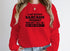 A Day Without Sarcasm Sweat Shirt featuring bold text on a vibrant red background.