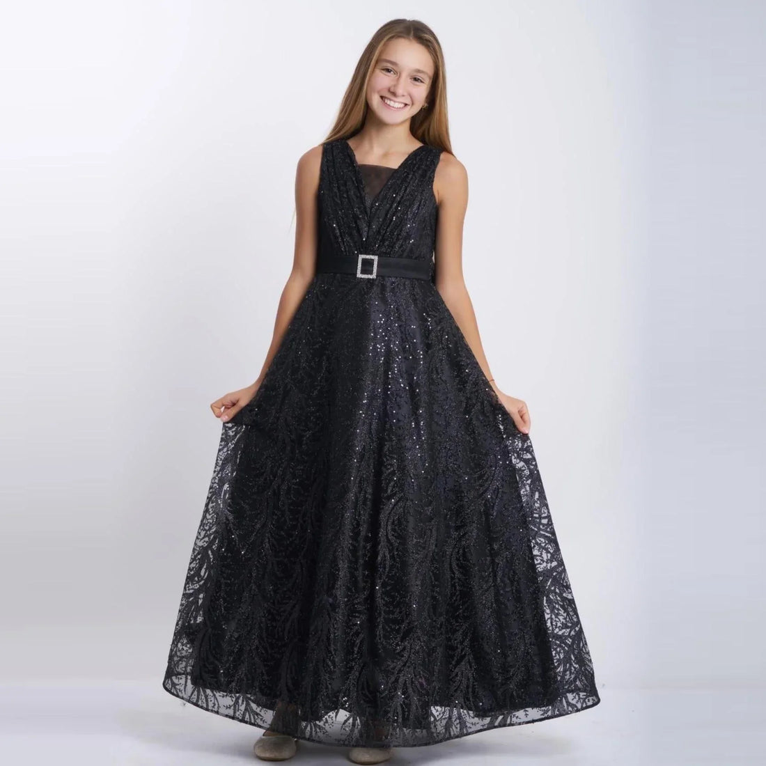Sparkling Beauty Girls Formal Dress worn by a smiling girl in a stunning black long tulle gown with sparkles.