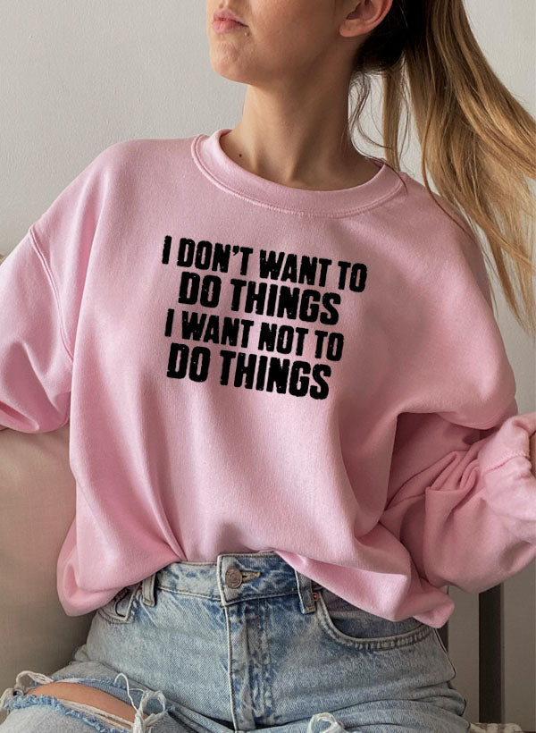 I Dont Want To Do Things Sweat Shirt displayed on a model in a cozy setting, showcasing its stylish design and comfortable fit.