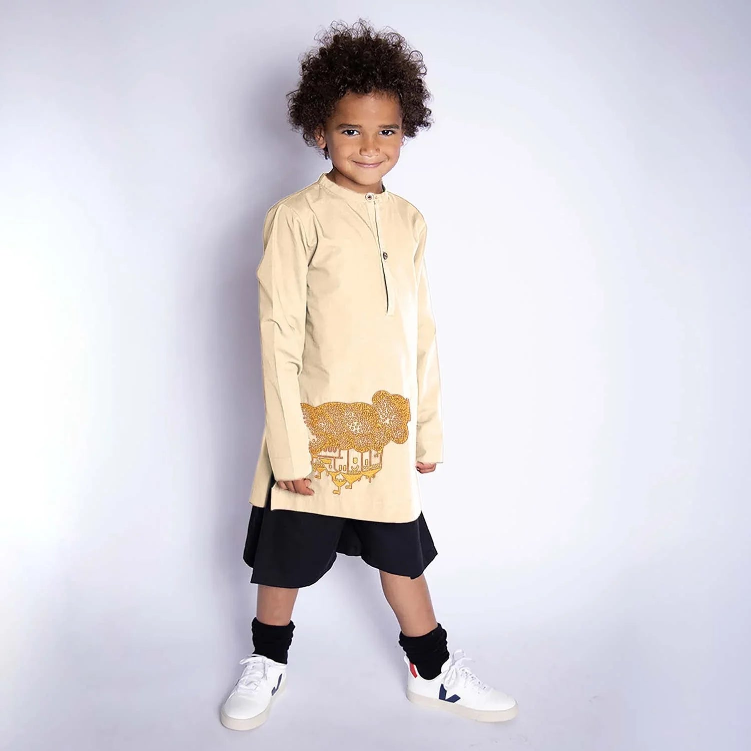 Beige Kids Tunic with Golden Castle Embroidery, featuring flounce sleeves and a cute hand-embroidered castle design.