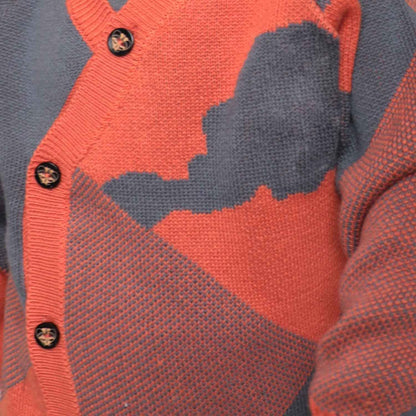 Baby Cardigan in Blue and Orange featuring a stylish geometric pattern and eco-friendly organic cotton.