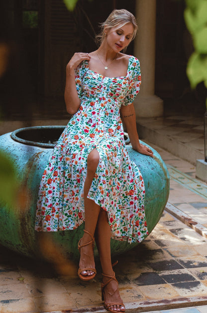 Lilit Midi Dress featuring a floral print, puff sleeves, and a relaxed fit, perfect for any occasion.