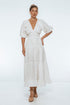 Lucienne Smocked Linen Maxi Dress with deep V neckline, puff sleeves and tiered skirt, perfect for day-to-night styling.