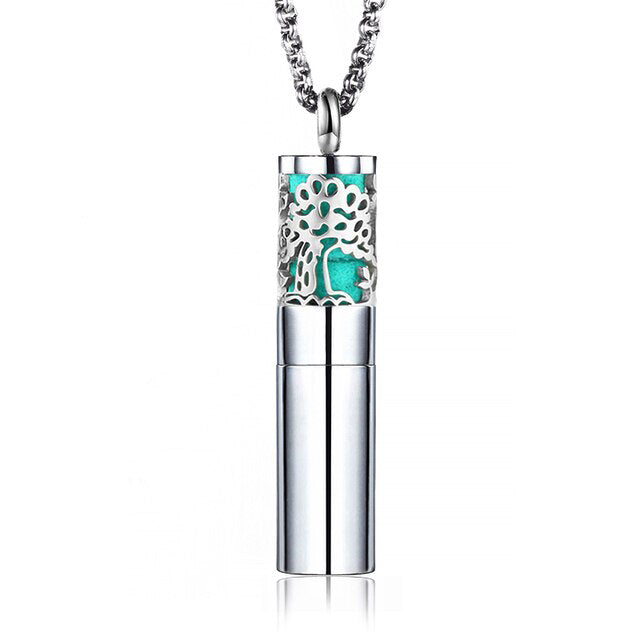 Designer essential oil locket necklace featuring a silver tree pendant for carrying favorite scents.