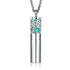 Designer essential oil locket necklace featuring a silver tree pendant for carrying favorite scents.