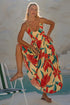 Sea Dreamer Strappy Midi Dress on a model with floral print, perfect for beachside summer gatherings.