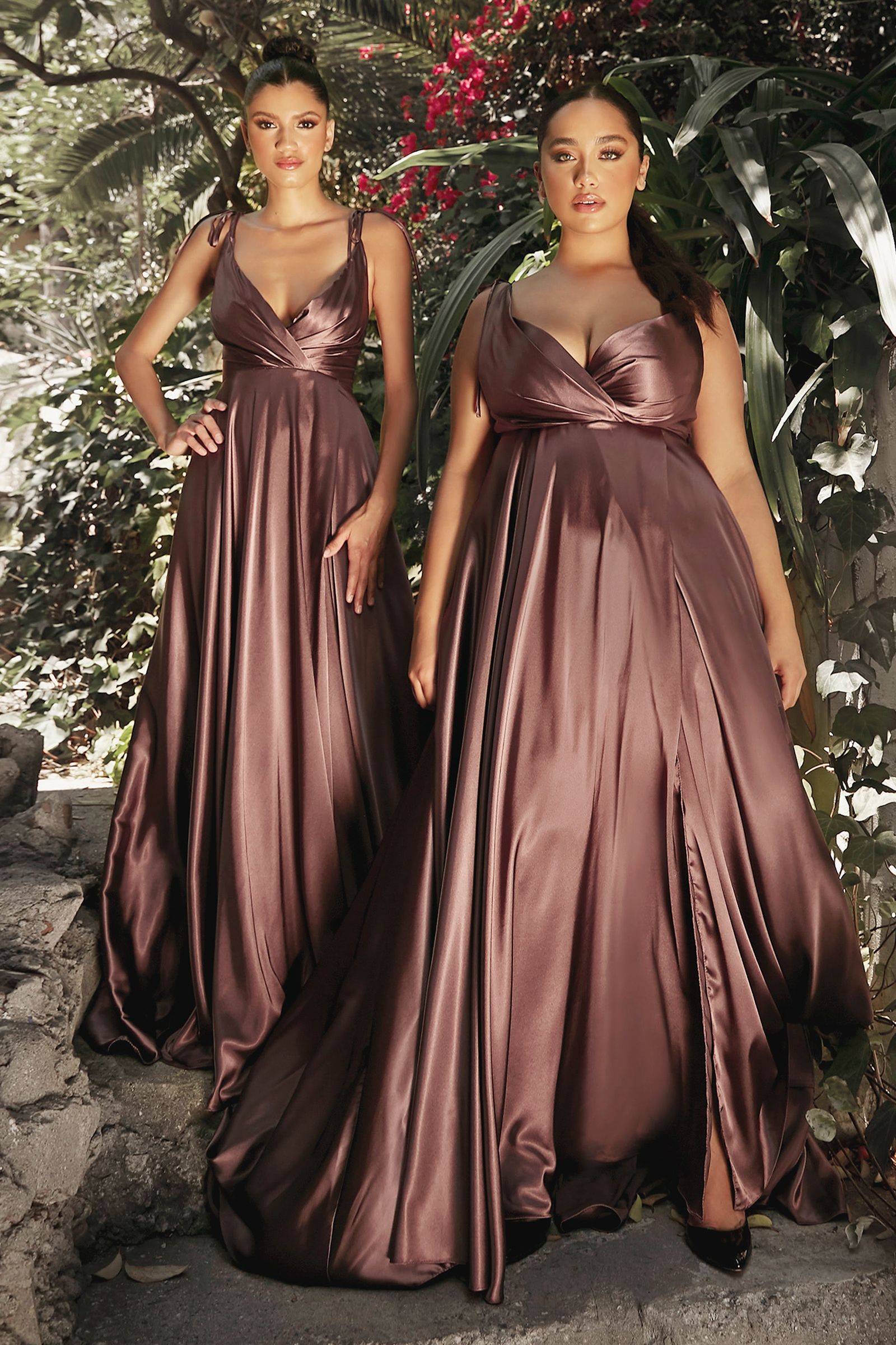 Flowy Satin A-Line Gown in rich brown worn by two models amidst a lush garden backdrop.