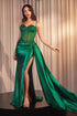 Elegant model in a green Embellished Lace & Satin Fitted Gown with intricate detailing and a dramatic train.