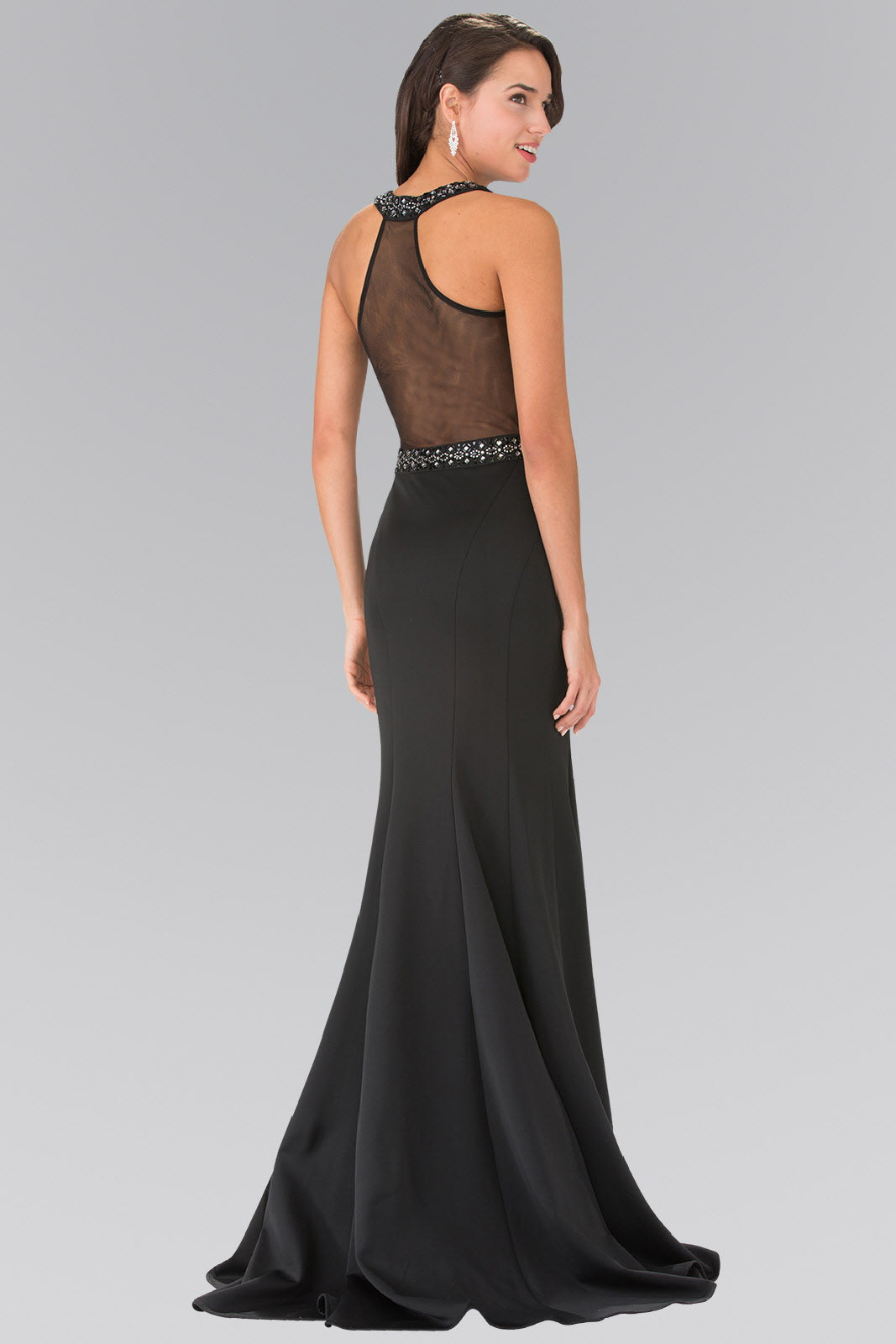 Elegant back view of a beaded long evening dress with sheer design and mermaid silhouette.