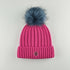 Fushia Tuque with removable blue fur pompom and ribbed design, 100% acrylic and polar fleece lining.