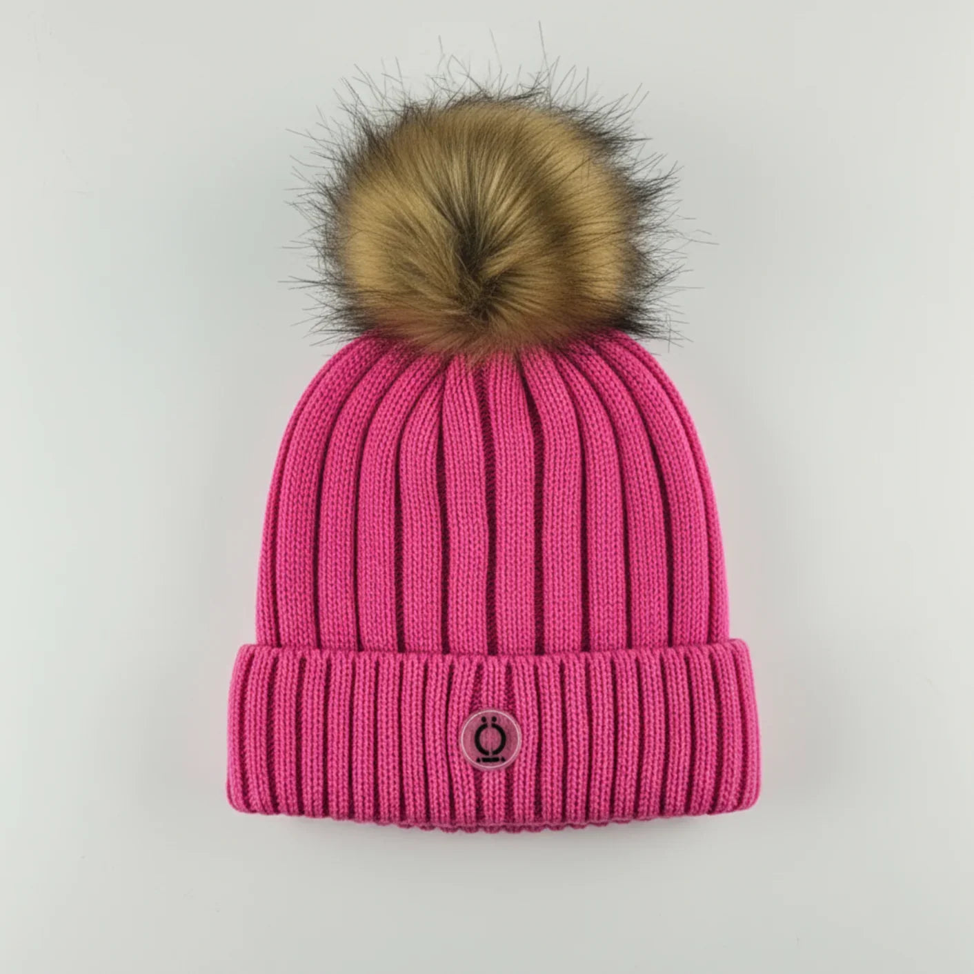 Fushia Tuque with removable faux fur pompom and soft polar fleece lining for warmth and style.