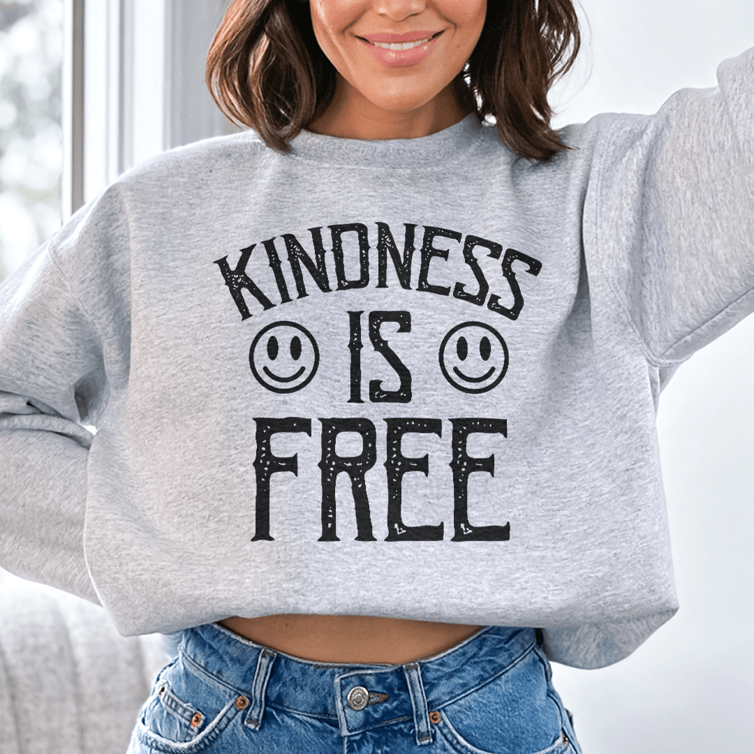 Woman wearing a cozy sweatshirt featuring the text &