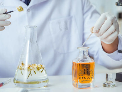 Scientist preparing fragrances for the free perfume collection by CHRISTOPHER HANLON® in a laboratory.