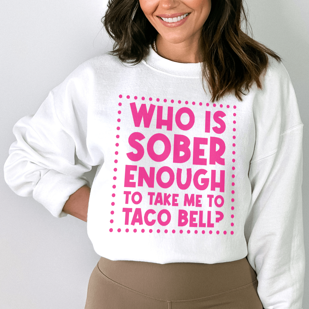 Woman smiling in a white sweatshirt with text &